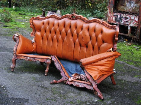 Commercial waste operatives handling bins at a collection site